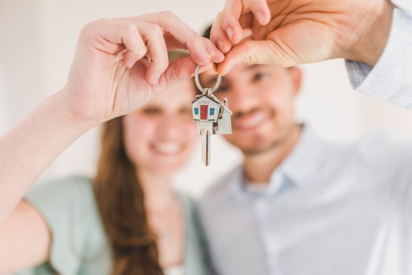 Couple holding house key Tristan